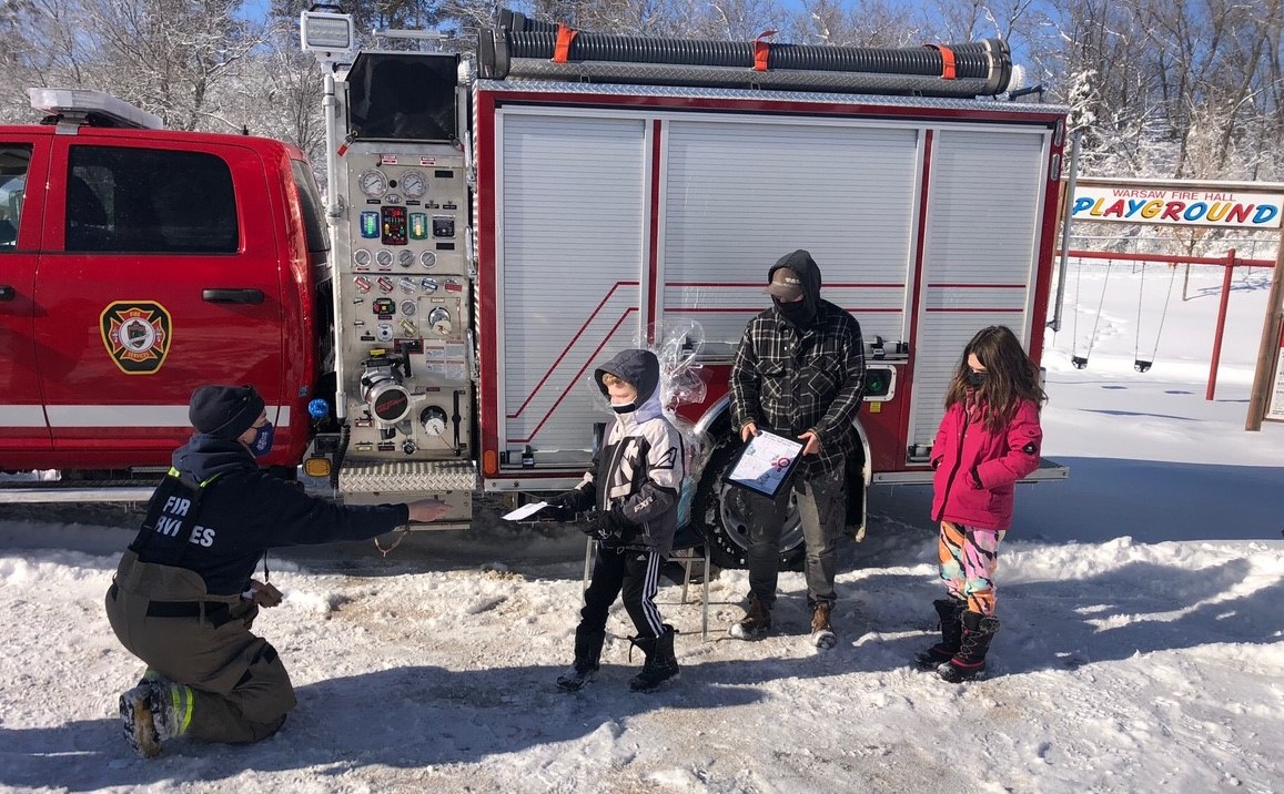 Emmet accepts his prize from DDFS personnel